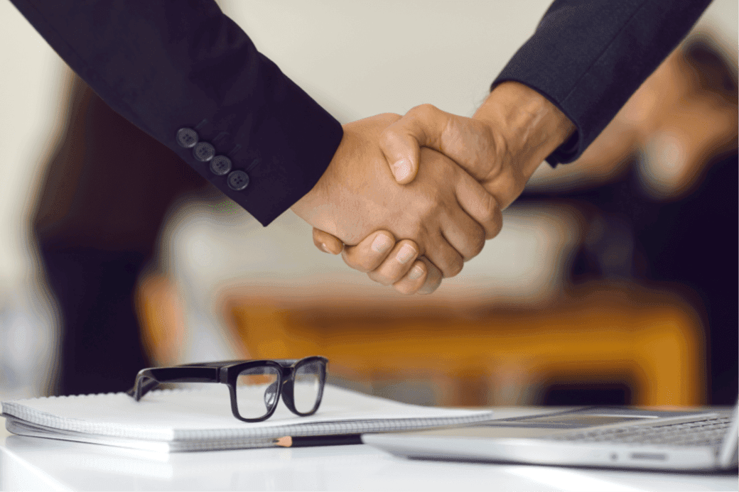 Two people shaking each other's hands