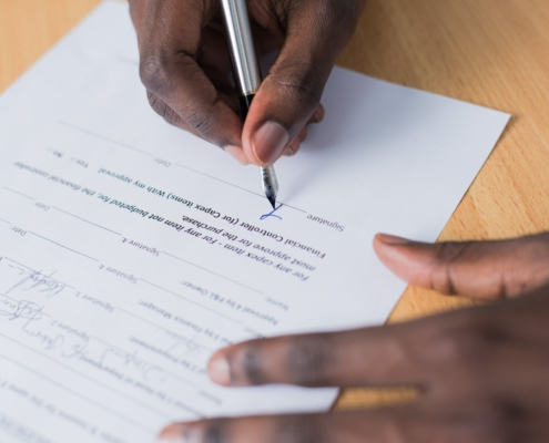 A person signing a document