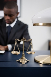 Brass Colored Balance Scale on a Lawyer's Table
