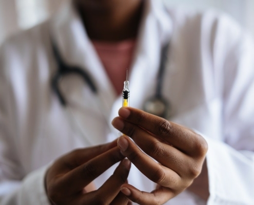 Aesthetic Surgeon holding Botox needle