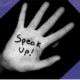 Someone's hand with 'speak up!' written on it